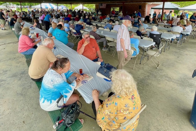 Seniors gather for a community picnic under a pavilion in Dover, NY.