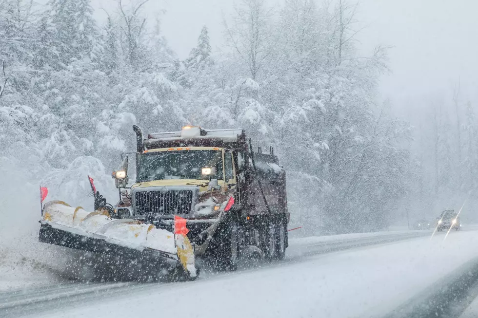 A snowplow clears a Dutchess County road during a winter storm.